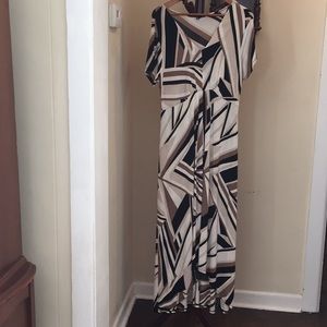 Black, brown, tan, Gown with train in back.